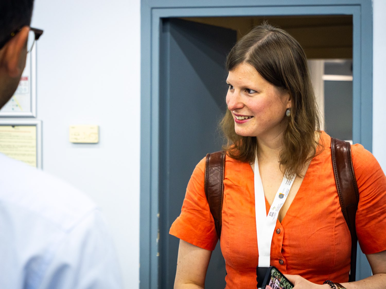 Delegates in conversation during a break.
