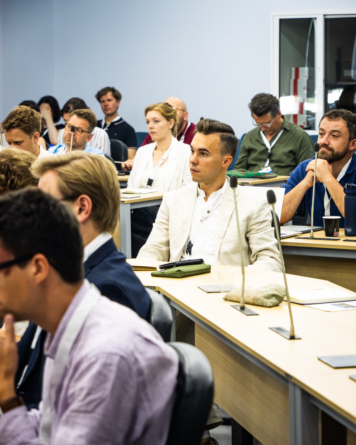 Delegates listening during a session.