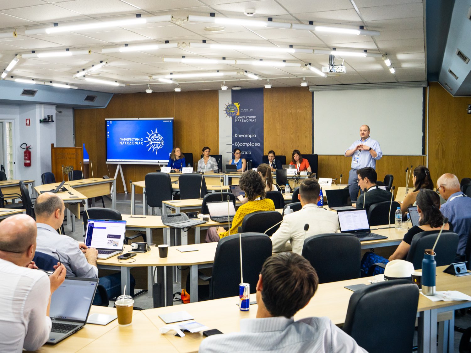 An open panel in session, with the EISS banner at the front of the room.