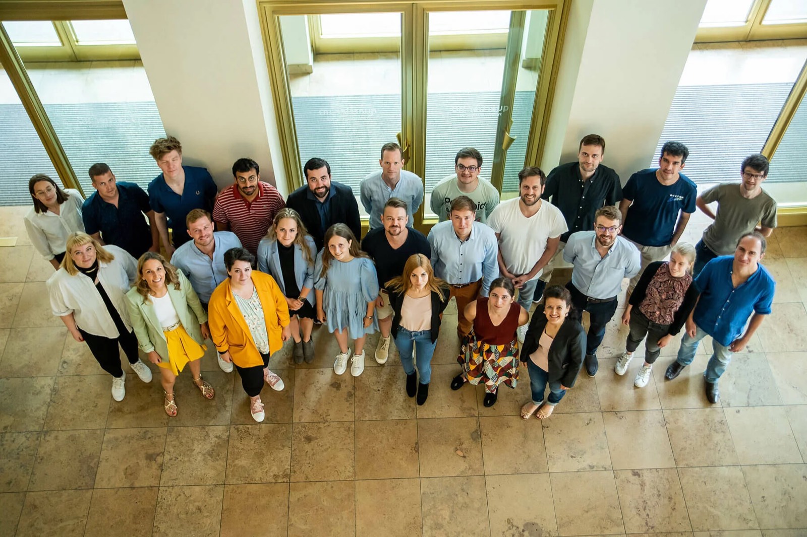 A Euro-SWAMOS cohort gathered indoors at the Hertie School in Berlin.
